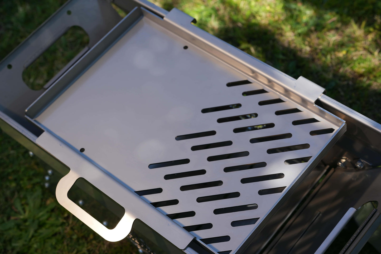 Stainless grill / hot plate on top of a portable camping fire pit / bbq