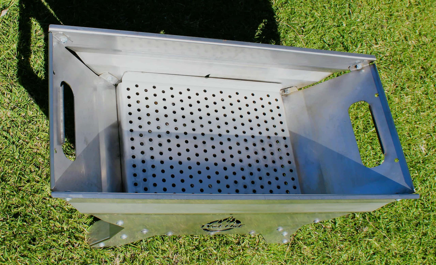 charcoal heat bead plate fitted to portable fire pit for grilling