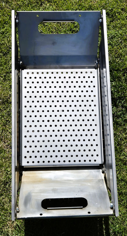 Metal grill with perforated design for charcoal grilling