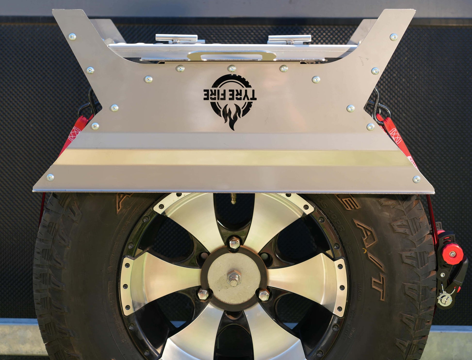 The Original Tyre Fire® mounted on a 4WD spare tyre featuring the integrated BBQ plate stored upside down to protect the cooking surface
