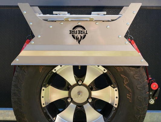 The Original Tyre Fire® mounted on a 4WD spare tyre featuring the integrated BBQ plate stored upside down to protect the cooking surface